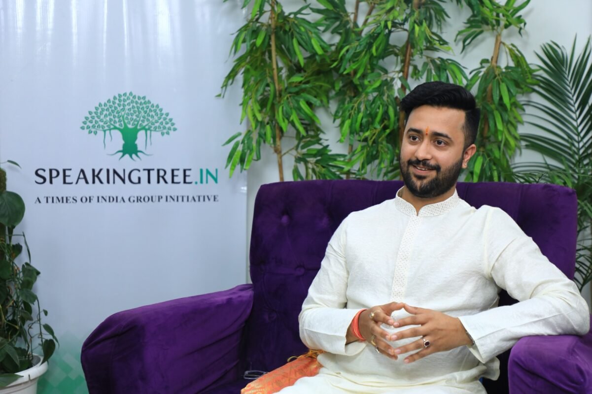 Parag Pandey seated beside the Speaking Tree, The Times of India Group, display